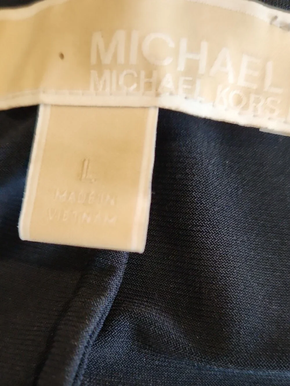 Michael Kors gold side